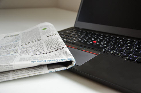 laptop and newspaper